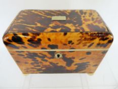 An Antique Blonde Tortoiseshell Tea Caddy, the interior fitted with two lidded compartments with