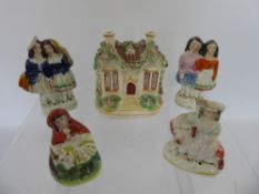 Miscellaneous Porcelain, including four Staffordshire miniature flat back figures and a cottage