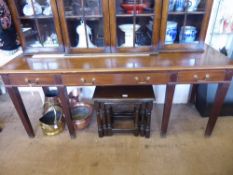An Antique Sideboard with two small drawers and one large central cutlery drawer, raised on reeded