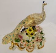 A 19th Century Royal Crown Derby Porcelain Peacock, red factory mark to base, approx 17 cms.