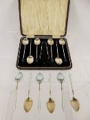 A Set of Gilt Silver and Enamel Coffee Spoons, beautifully enamelled with floral spray together with