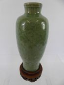 A Chinese Celadon Green Earthenware Ming Vase, the vase with floral cross-banded design, approx 16.5