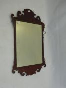 A Mahogany Mirror (Chippendale style) approx 95 x 57 cms. (wf), together with one other.