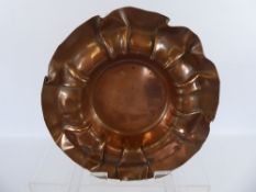 An Art Nouveau Copper Dish in the form of a flower, approx 22 cms high.