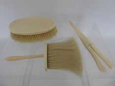 A Gentleman's Lot, comprising of an ivory hair brush, hat brush and glove stretchers. (3)