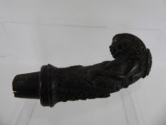 An Antique Indonesian Carved Horn Handle, believed to a Kris dagger handle, depicting a mythical