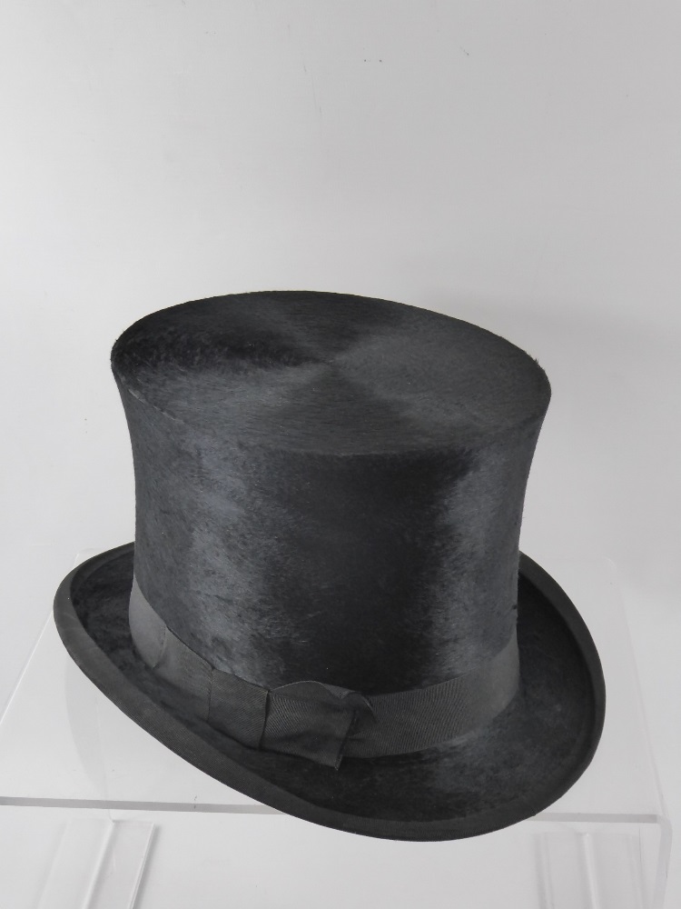 A Boxed Silk Top Hat, inner circumference approx 60 cms, the interior lining to hat damaged and some