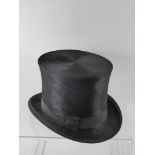 A Boxed Silk Top Hat, inner circumference approx 60 cms, the interior lining to hat damaged and some