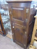 Bevan Funnell Reprodux Oak Cupboard, with central brush slide and two cupboards one above and one