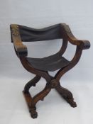 A Circa 1880 Savonarola Walnut X-Frame Dante Folding Chair, with leather seat and backrest, paw