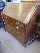 A George III Applewood Drop Front Bureau, four graduated drawers, the drop-front revealing writing