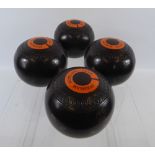 Eclipse Jacques London, a set of four bowling balls labelled for the Evesham Bowling Club.