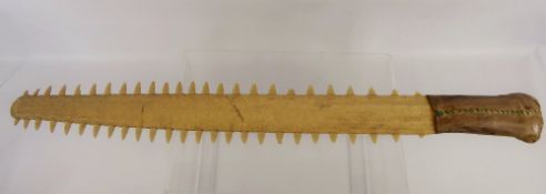 An Antique Sword Tooth Shark Bill Club, with hand stitched leather handle, approx 69 cms.