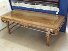 A Chinese Hardwood Low Table, having scroll decoration to skirt, approx 122 x 51 x 40 cms.