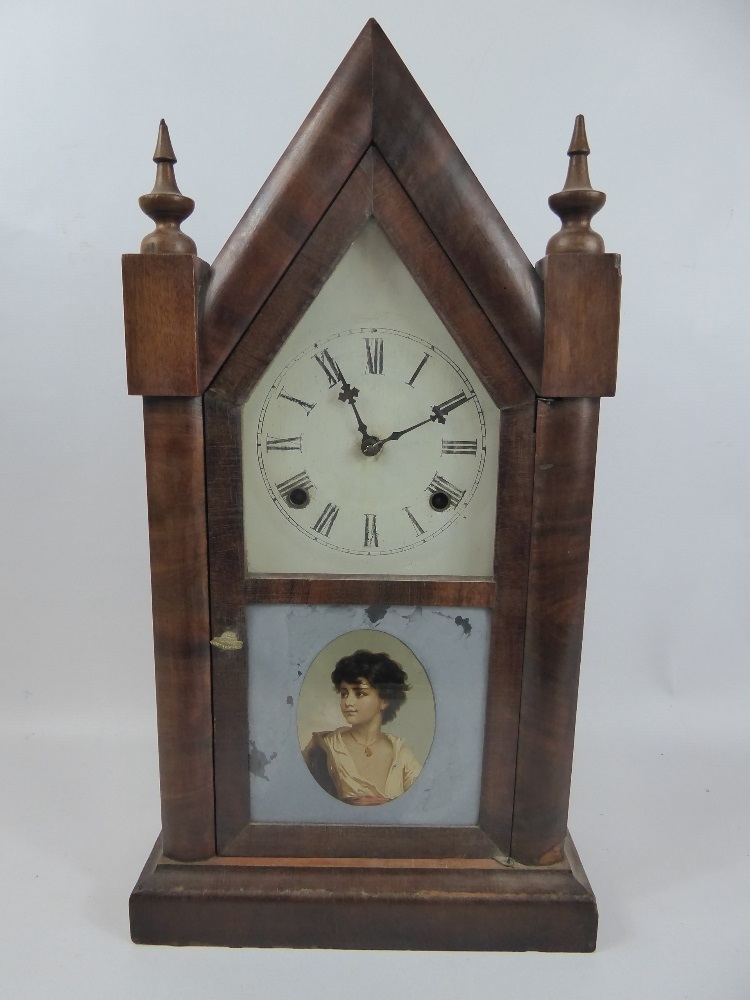 A Gothic Style Ansonia Clock Co Mantel Clock, white enamel face, Roman dial, the glaze door front