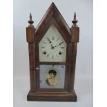 A Gothic Style Ansonia Clock Co Mantel Clock, white enamel face, Roman dial, the glaze door front