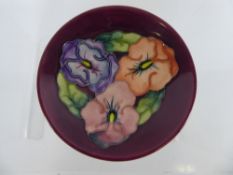 A Moorcroft Round Pin Dish, depicting Pansies 1993 approx 12 cms,