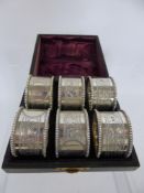 A Set of Victorian silver napkin rings, mm H & T, Birmingham hallmark, dated 1876, in the original