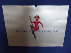 Five Pirelli Calendars depicting images of women, approx 60 x 42.5 cms.