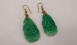 A Pair of Chinese Green Jade Effect Earrings, depicting flowers, in yellow metal mount