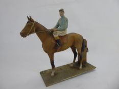 A Lead Figure of a Race Horse and Rider, approx 18 cms.