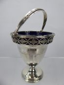 A Silver Sweet Meat Basket, with blue glass liner, the vase having pierced foliate design, Sheffield