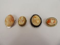 Three Silver and One Yellow Metal Shell Cameo Brooches, depicting classical profiles.