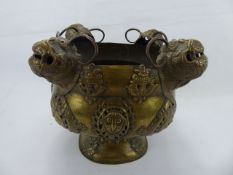 An Antique Tibetan Incense Burner, the burner with mask and Buddhist symbols in relief, approx 23