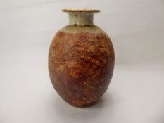 R. Higgs for Winchcombe Pottery, beige and ochre ovoid vase, approx 20 cms, with incised decoration,