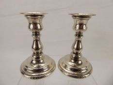 A Pair of Silver Candlesticks.