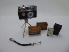 A Phenix Camera Lighter together with a miniature vintage Camel lighter and matches.