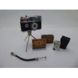 A Phenix Camera Lighter together with a miniature vintage Camel lighter and matches.