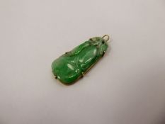 A Chinese 18 ct Yellow Gold White and Bright Green Jade Pendant in the form of fruit, approx 38 x 18