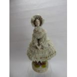 A German Porcelain Figurine, with delicate lace-work dress, factory mark to base, approx 32 cms.