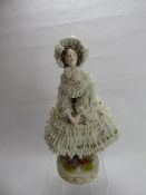 A German Porcelain Figurine, with delicate lace-work dress, factory mark to base, approx 32 cms.