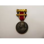 A Good Conduct Medal dated 1913-14, together with two books A Copy of "Donald and his Friends", by