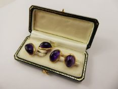 A Pair of Gentleman's 15 ct Yellow Gold and Amethyst Cabachon Cuff Links, approx wt. 8.9 gms.