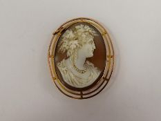 An Antique Shell Cameo Pendant, carved with a classical profile, approx 4.5 x 3.5 cms, contained