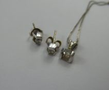 A 14 ct White Gold Diamond Pendant and stud earring set, ear studs approx 18 pts dia, the pendant