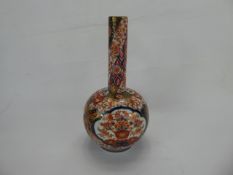 A 19th Century Japanese Imari Onion Vase, typical palette with foliate decoration and mythical