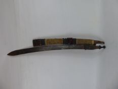 An Antique Sudanese Sword, cast iron finial to handle and wooden sheath wrapped in animal skin,