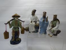 A Quantity of Japanese Shi Wan Figurines, depicted in various poses, including fishing, a scribe,