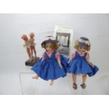 A Pair of American Dolls, by Madame Alexander, dressed in blue and pink outfits with navy blue straw