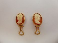 A Pair of Lady's Shell Cameo Earrings, stamped 14k, approx wt 6.1 gms..