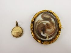 A Victorian Mourning Portrait Pendant Brooch, set in a 14 ct yellow gold mount, approx 4 x 5 cms,