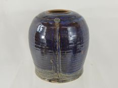 A Tin Glazed Studio Pottery Vase, with incised decoration depicting a 'smiley face', approx 21 cms