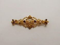 An Antique 15 ct Yellow Gold Pearl and Garnet Brooch, the brooch in the form of two ornate hearts,