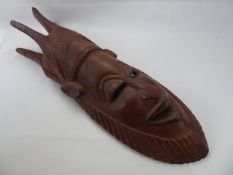 An African Wooden Tribal Mask, approx 87 x 27 x 15 cms.