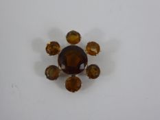 An 18 ct Yellow Gold Star Form Citrine and Quartz Brooch, centre stone 13 mm, outside stones 6 mm,