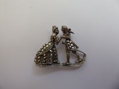 A Silver and Marcasite Brooch, of a couple dancing.